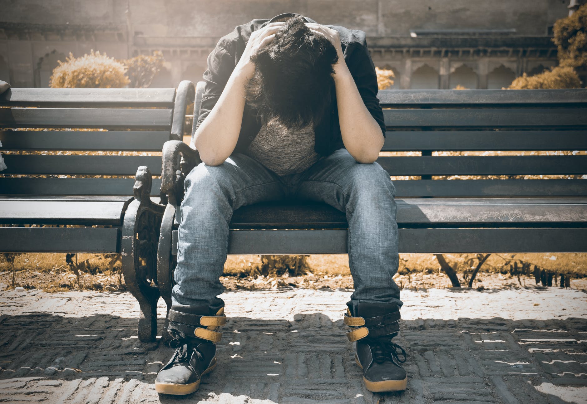 A person preparing to take a small brave step